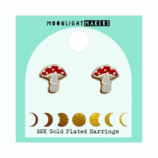 22K gold plated red mushroom stud earrings with enamel detail displayed on branded card with moon phase design