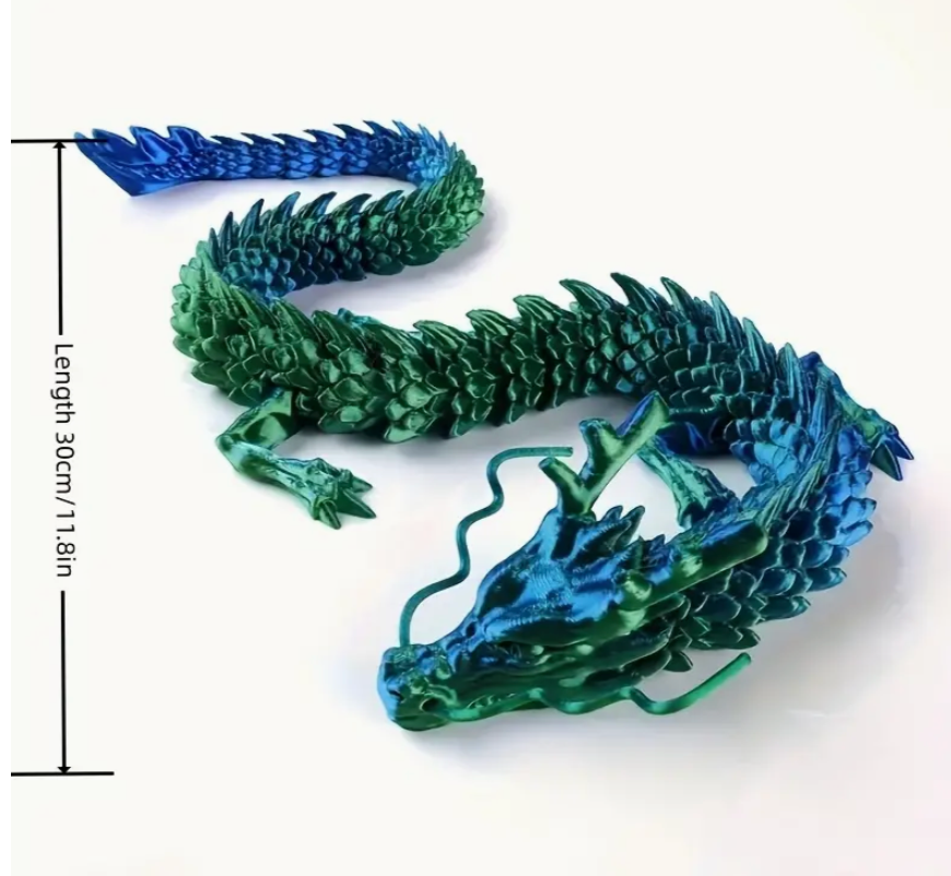 Green and blue dragon figurine with measurements on a white background