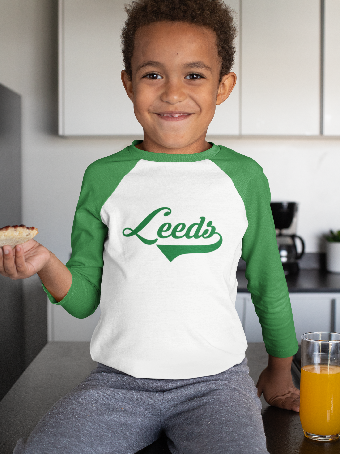 3/4 sleeve raglan shirt with Kelly green sleeves, size 6, featuring "Leeds," ideal for small-town pride.