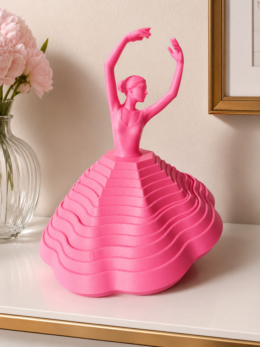 Pink 3D printed ballerina fidget spinner displayed upright with layered skirt design and ballet-inspired silhouette.