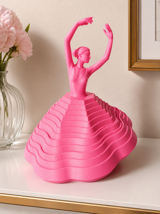 Pink 3D printed ballerina fidget spinner displayed upright with layered skirt design and ballet-inspired silhouette.