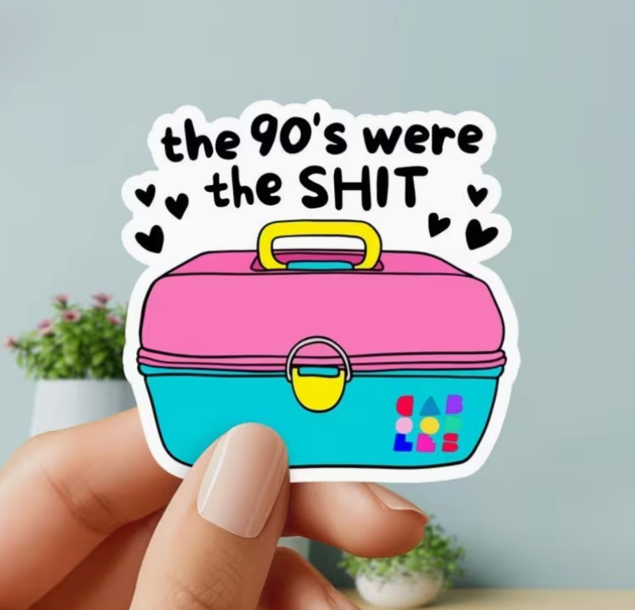 Colorful The 90s Were the Shit sticker featuring a pink and turquoise retro Caboodle style case