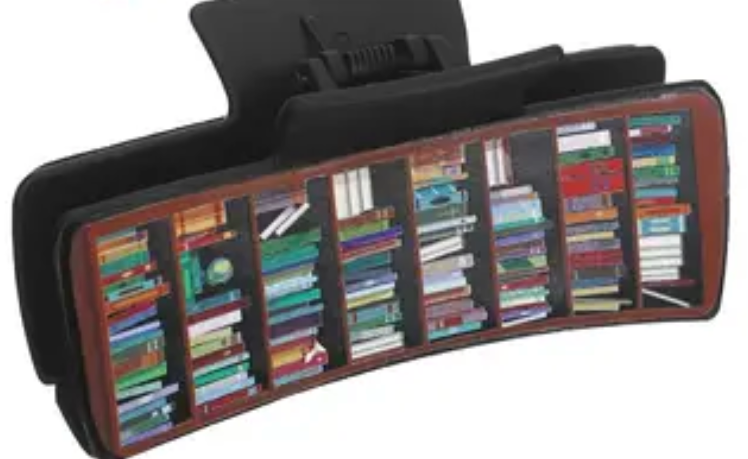 Hair clip with books displayed on a white background
