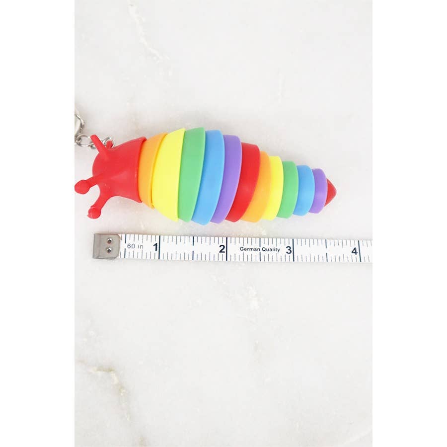 Rainbow-colored 4-inch fidget slug keychain with articulated body for stress relief and sensory play