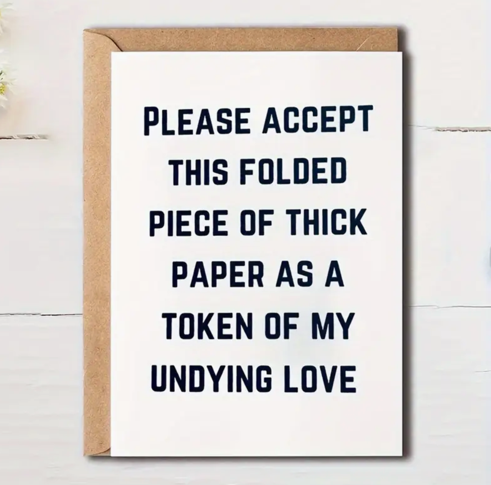 Funny romantic greeting card with the text "Please Accept This Folded Piece of Thick Cardboard as a Token of My Undying Love."