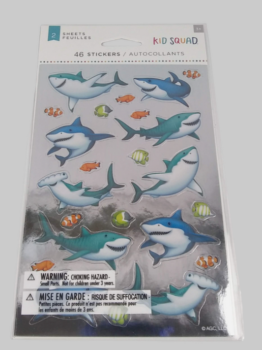 Pack of shark stickers with warning label on a gray background