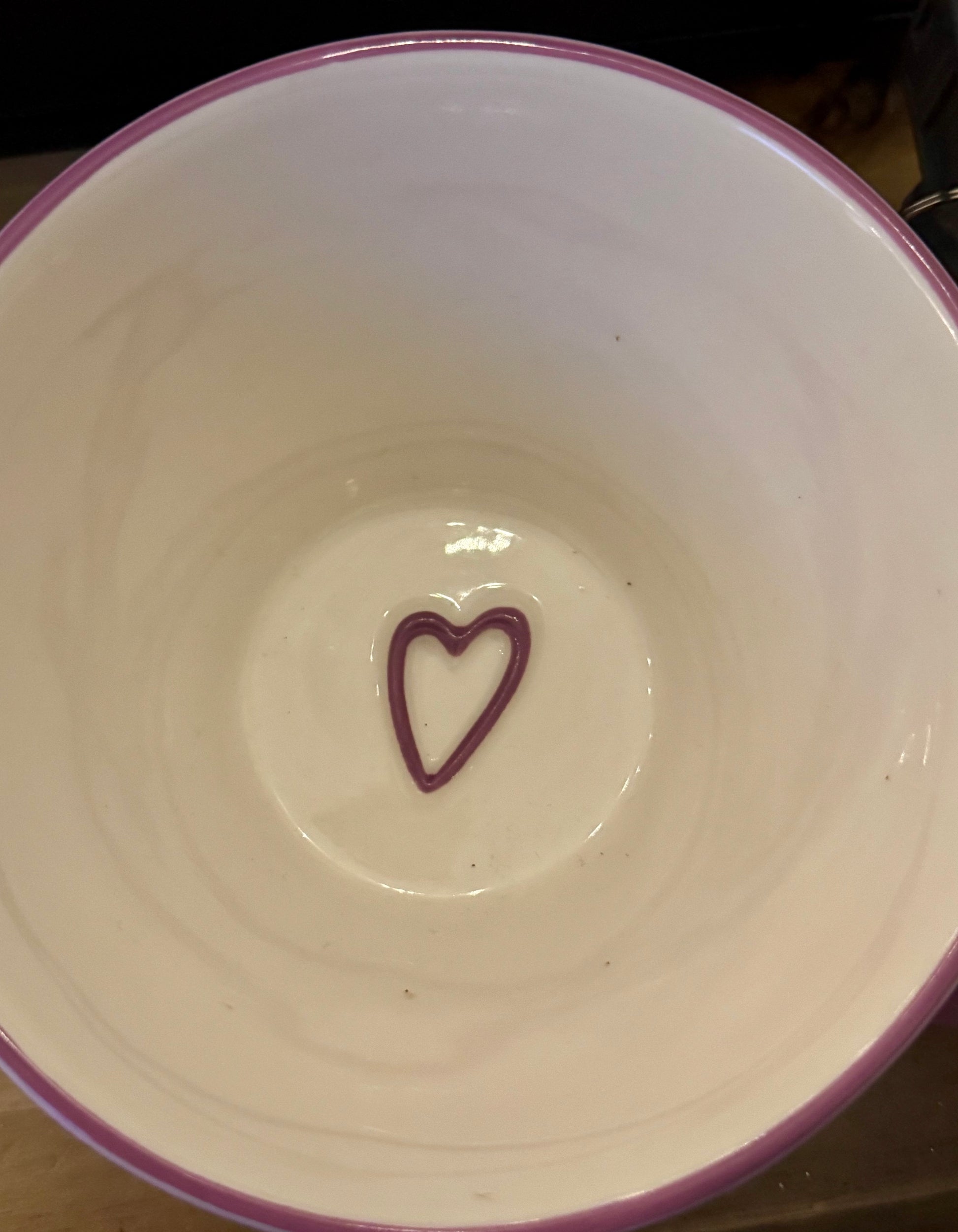 Lavender ceramic mug with a purple heart at the bottom inside
