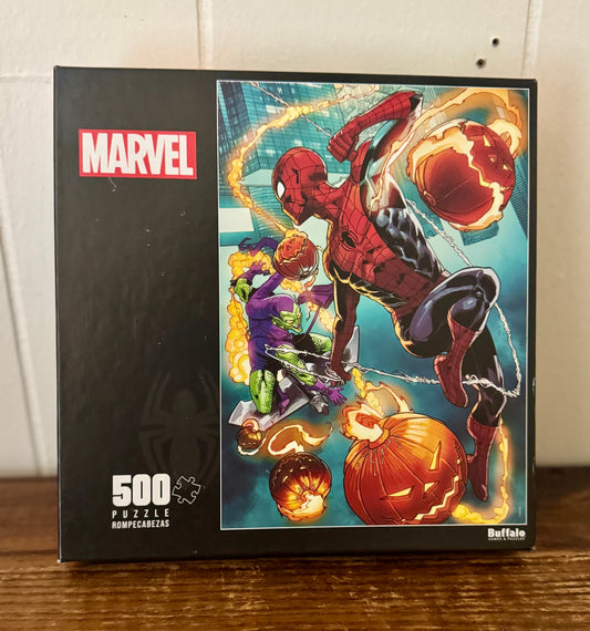Marvel Spider-Man puzzle box with Halloween theme on a wooden surface