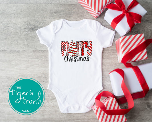 Baby bodysuit that says Merry Christmas with the letter E replaced by a Christmas tree snack cake design
