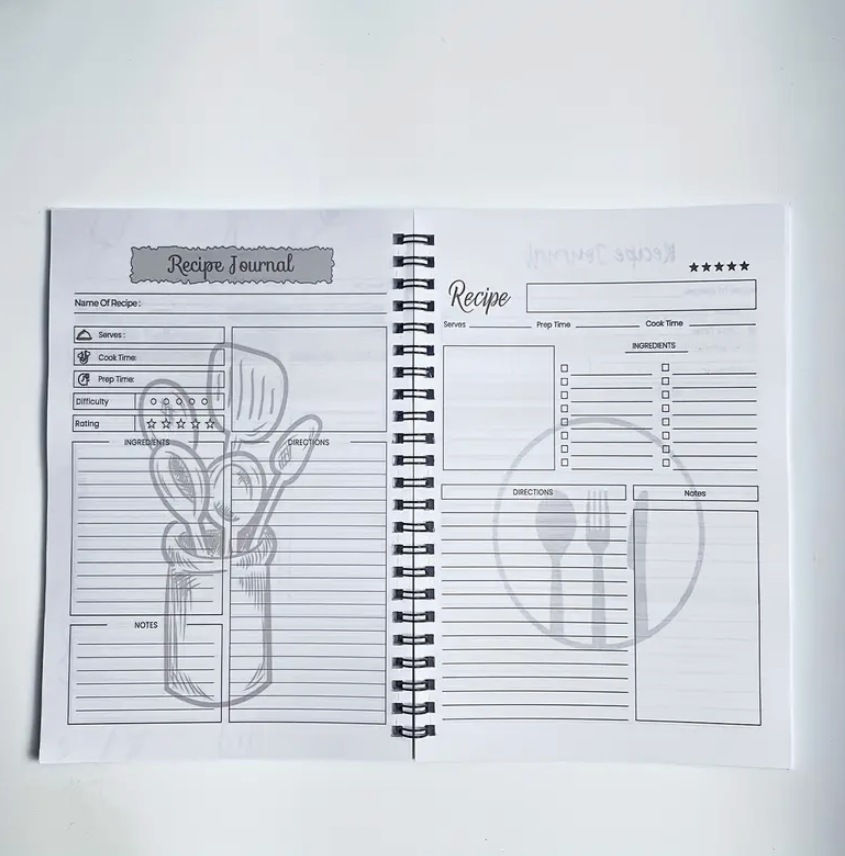 Recipe journal with spiral binding on a white background