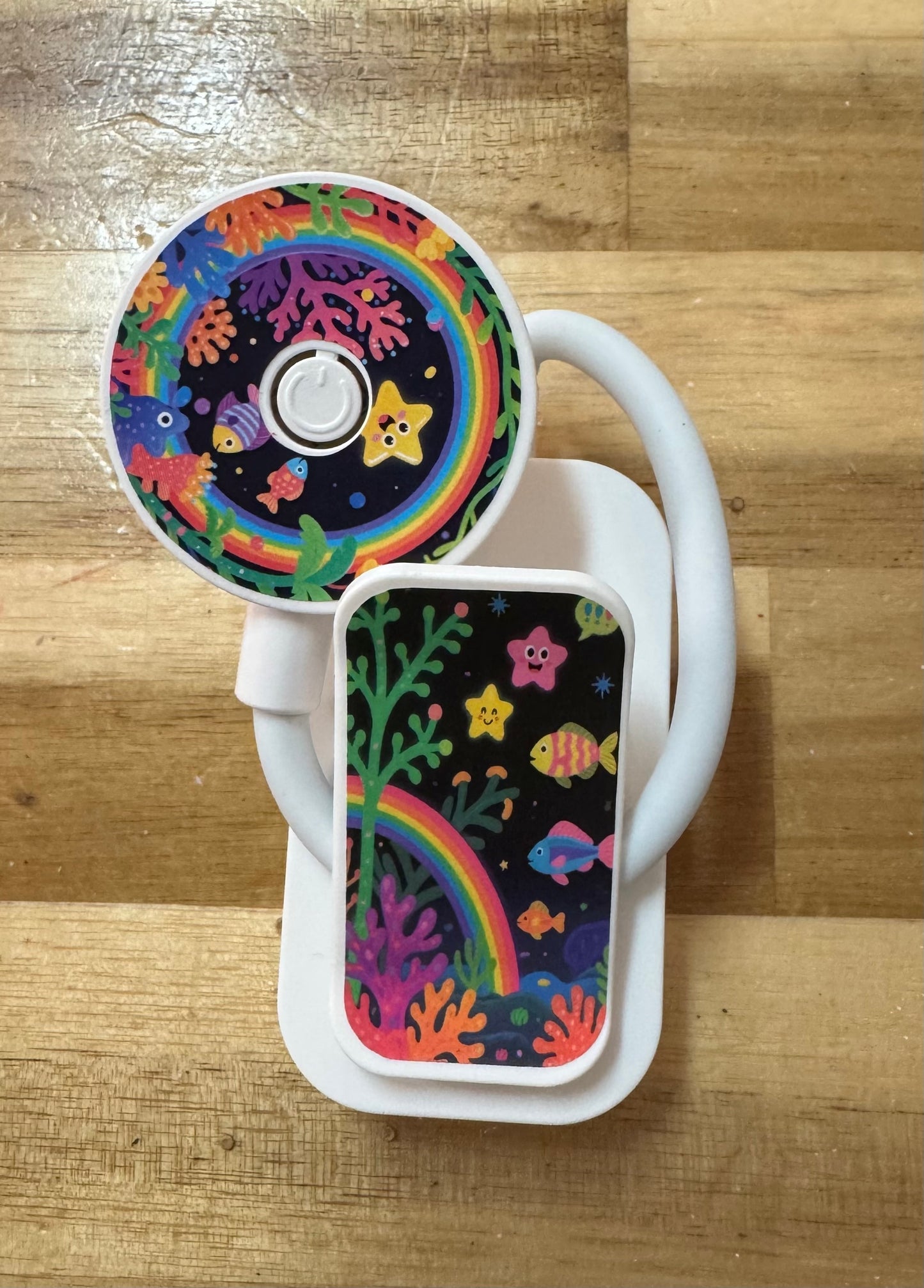 Colorful book light with rainbow and star design on a wooden surface