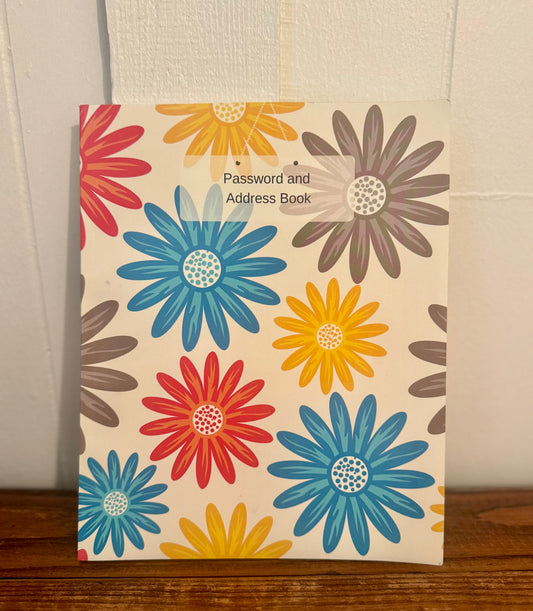 Floral-covered notebook with labeled sections for storing passwords, addresses, and birthdays—both practical and pretty.