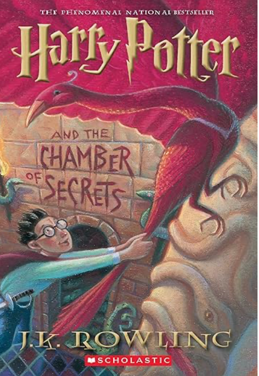 Book cover of 'Harry Potter and the Chamber of Secrets' with a red dragon and Harry Potter.