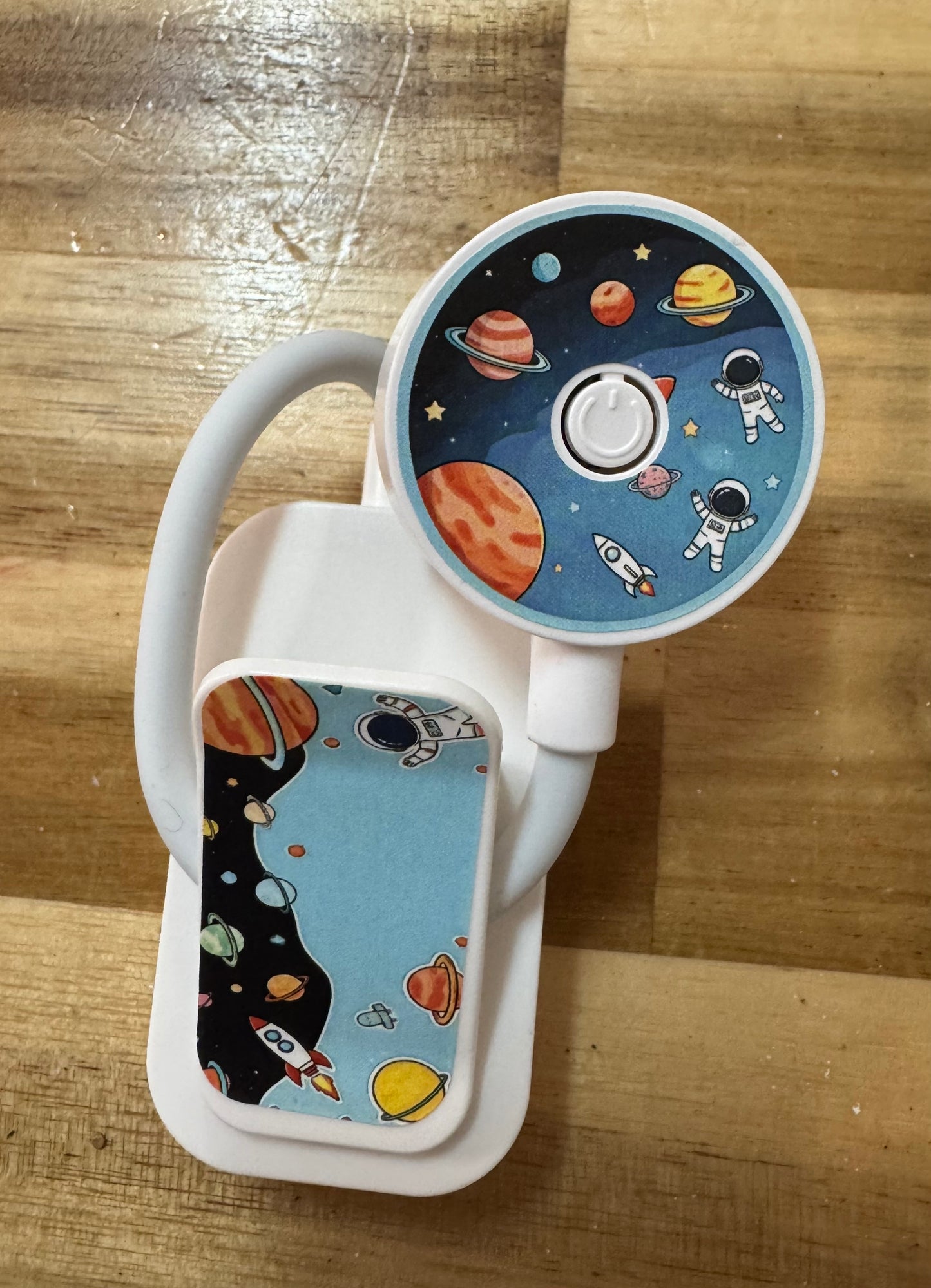Children's book light with space-themed design on a wooden surface