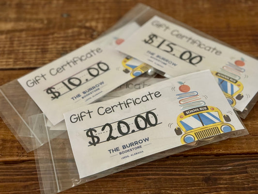 Three gift certificates for 'The Burrow' bookstore on a wooden surface