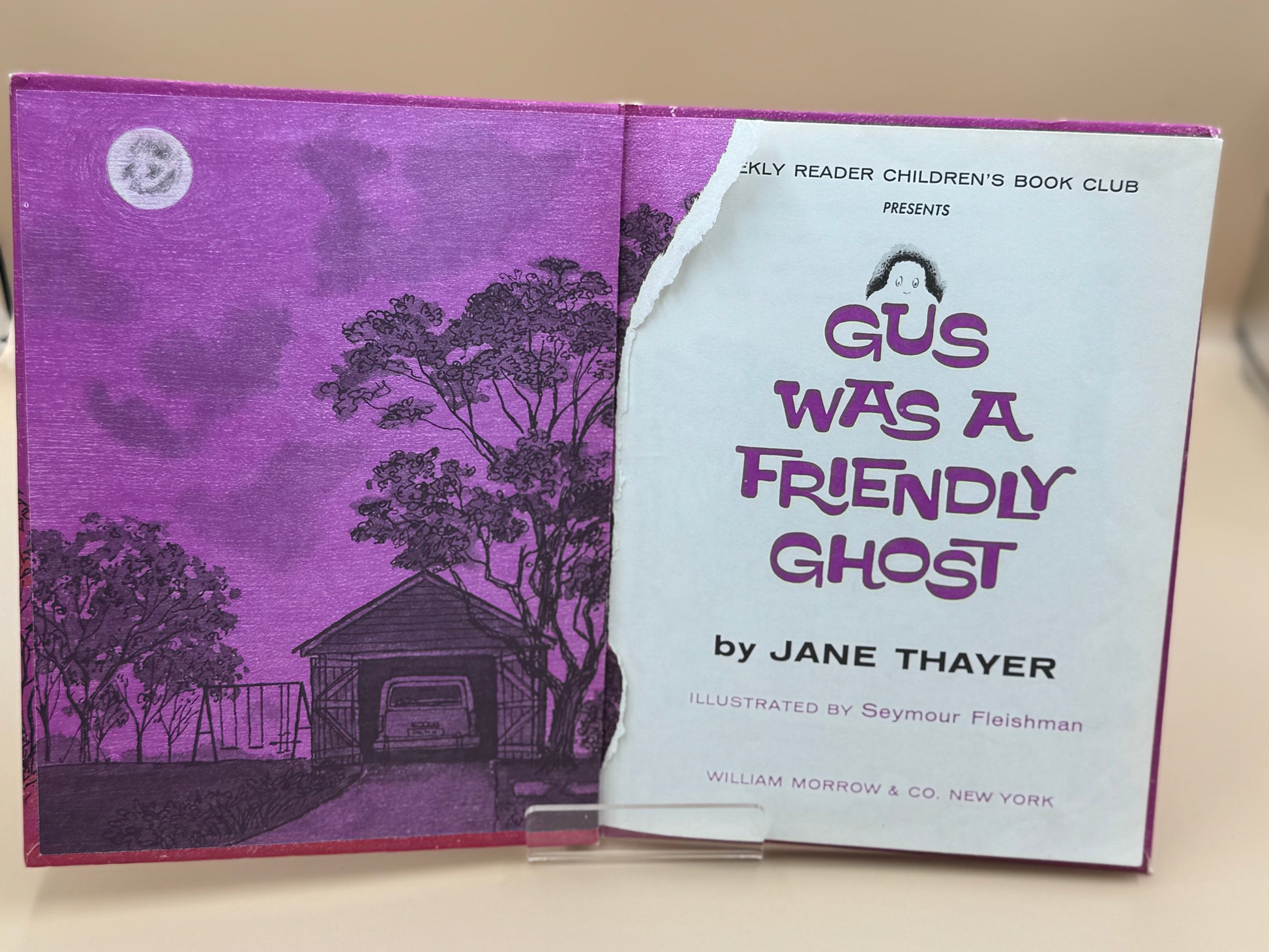 Children's book titled 'Gus Was a Friendly Ghost' by Jane Thayer with purple cover and white text.