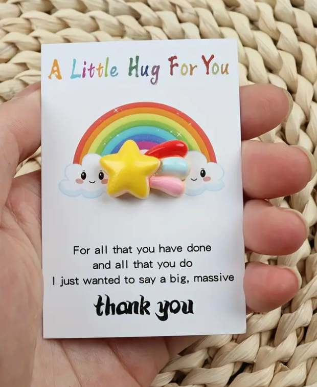 Pocket hug token with the message A little hug for you for all that you have done and all that you do I just wanted to say a big, massive thank you! and a colorful rainbow with a shooting star.