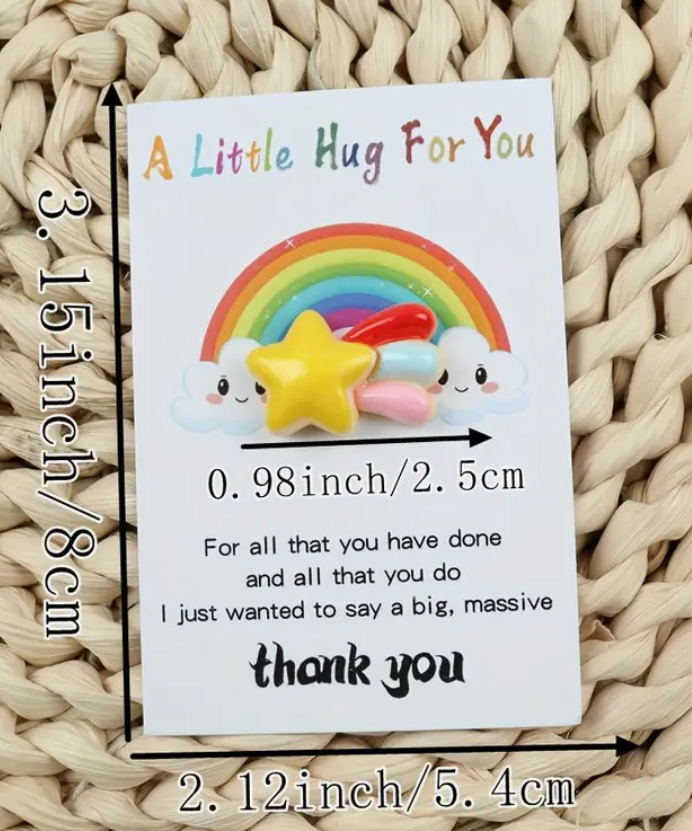 Pocket hug token with the message A little hug for you for all that you have done and all that you do I just wanted to say a big, massive thank you! and a colorful rainbow with a shooting star.