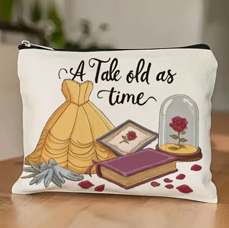 A Tale Old as Time zipper pouch with golden princess gown, enchanted red rose under glass, vintage book and rose petals on a cream background