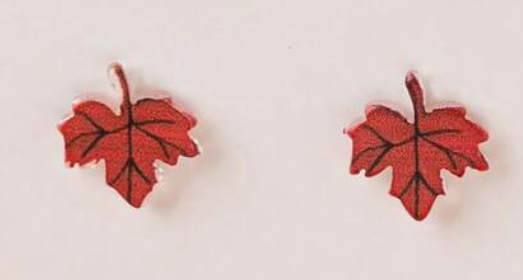 Red leaf-shaped earrings on a light gray background