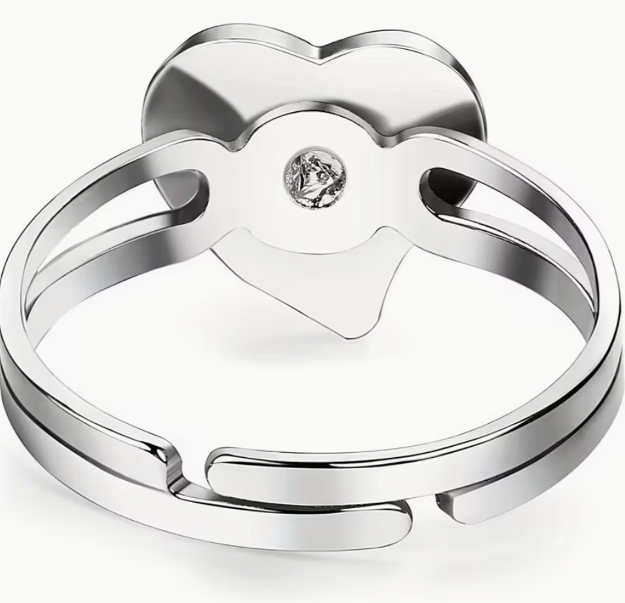 Adjustable silver tone heart mood ring showing open back band and adjustable sizing design
