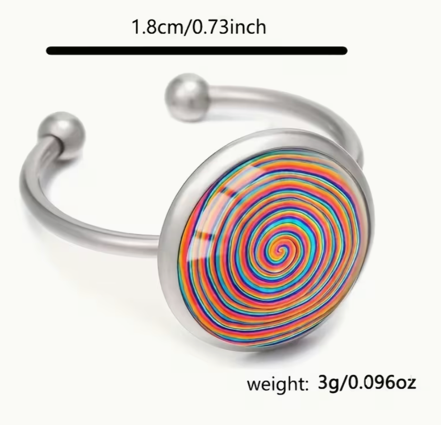 Adjustable silver tone ring with a round multicolor spiral glass cabochon, shown with size measurement of 1.8 cm (0.73 inch) and weight listed as 3 g (0.096 oz