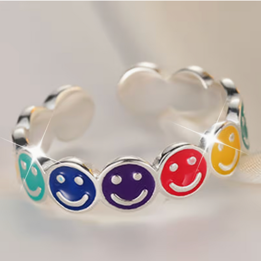 Adjustable silver tone ring featuring colorful enamel smiley faces in blue, purple, red, yellow, and green on an open adjustable band