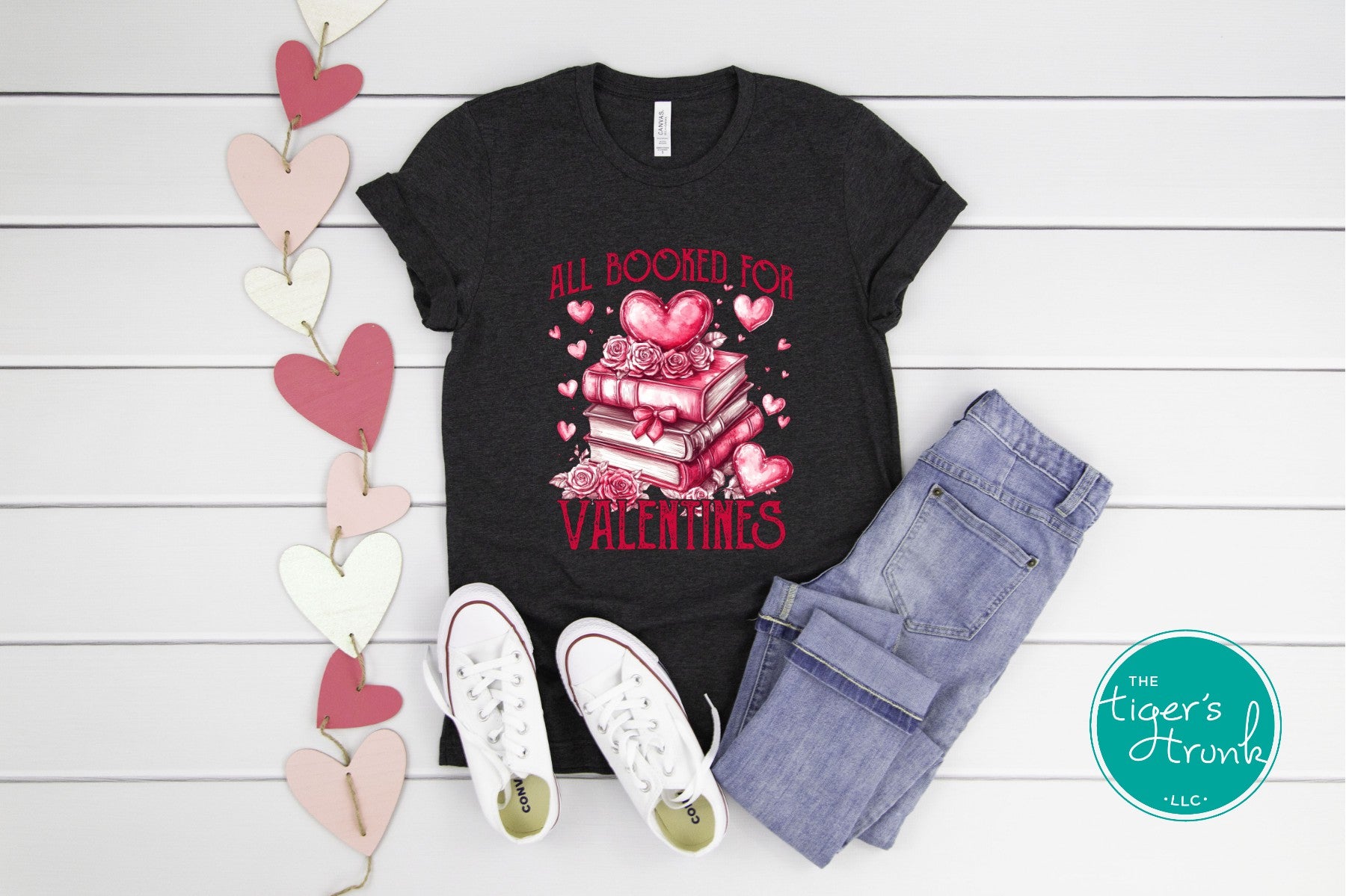 Book lover Valentine’s shirt with stacked books, hearts, and roses, featuring the phrase "All Booked for Valentine’s."