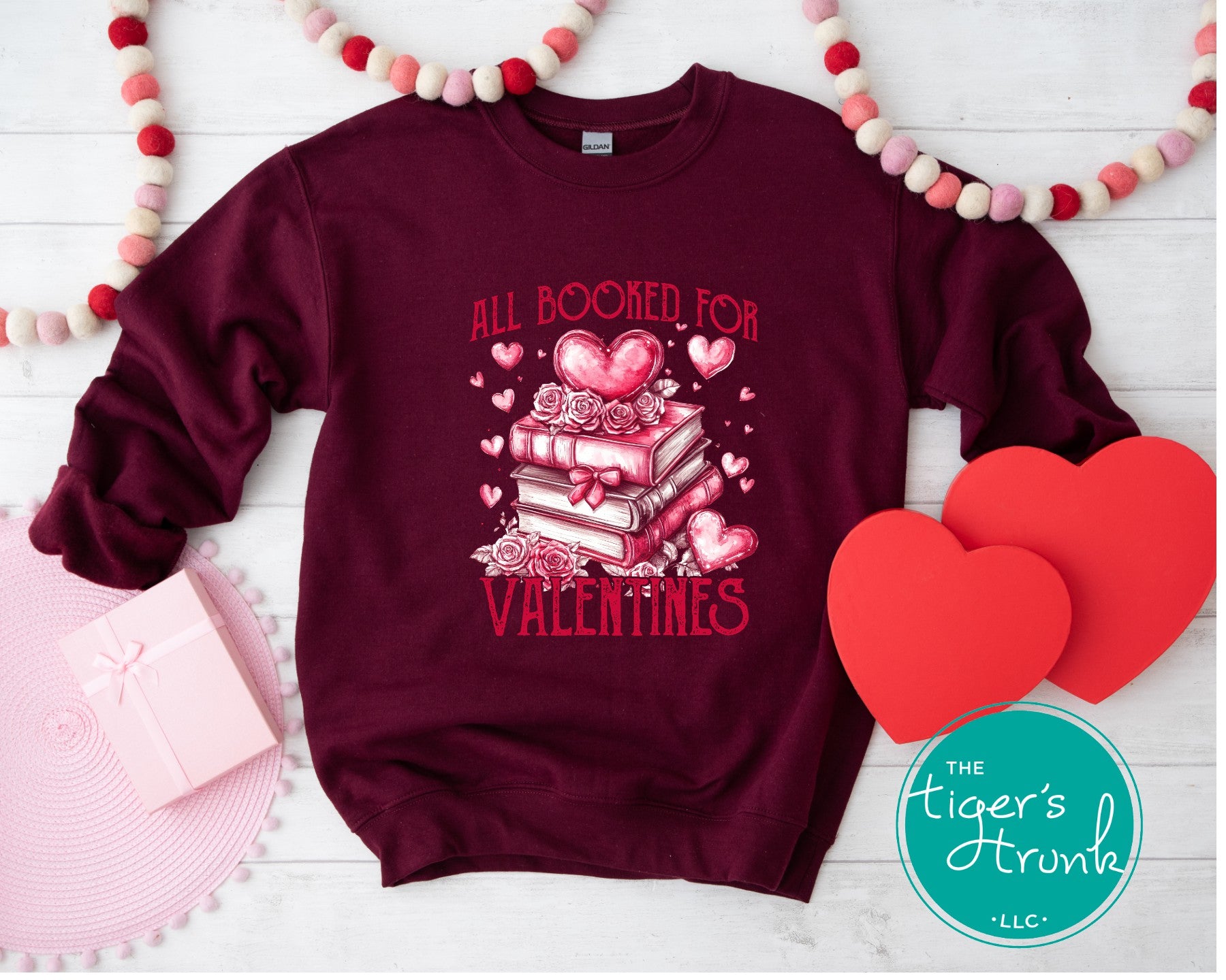 Book lover Valentine’s shirt with stacked books, hearts, and roses, featuring the phrase "All Booked for Valentine’s."