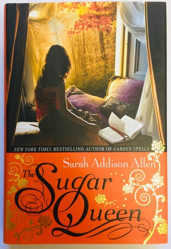 Cover of The Sugar Queen by Sarah Addison Allen, featuring a cozy and whimsical design reflecting the novel’s magical realism.