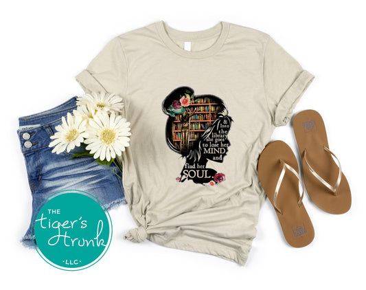 T-shirt with quote "And to the Library She Goes to Lose Her Mind and Find Her Soul," mental health and book lover escape design