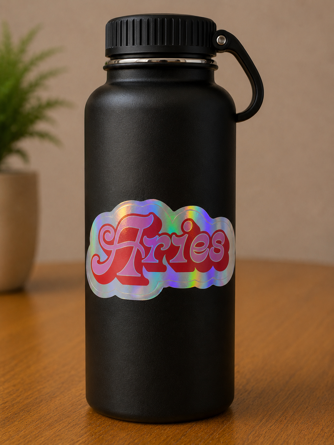 Aries holographic vinyl zodiac sticker displayed on a black water bottle with colorful retro lettering.