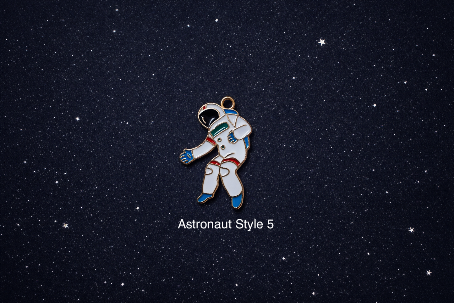 Individual astronaut space charm for jewelry making shown on a dark starry background, suitable for bracelets, necklaces, and keychains