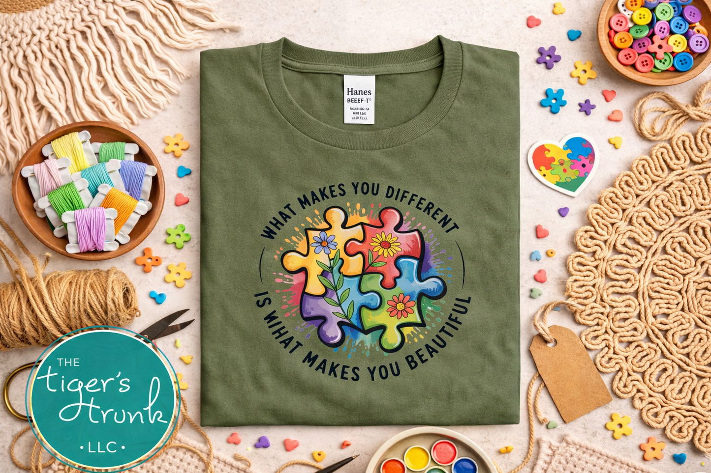 Green t-shirt with colorful puzzle design and text on a decorative background with craft supplies.