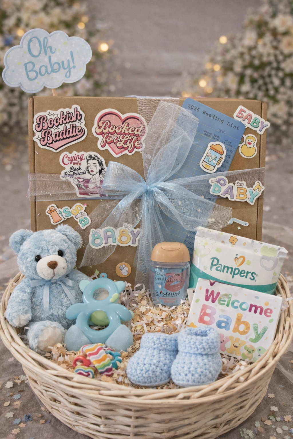 Baby gift basket with teddy bear, toys, and baby products on a neutral background