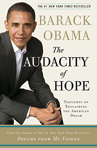 This image features the hardcover edition of "The Audacity of Hope" by Barack Obama. The book cover displays a photograph of Obama in a suit, seated in a casual pose against a plain background.