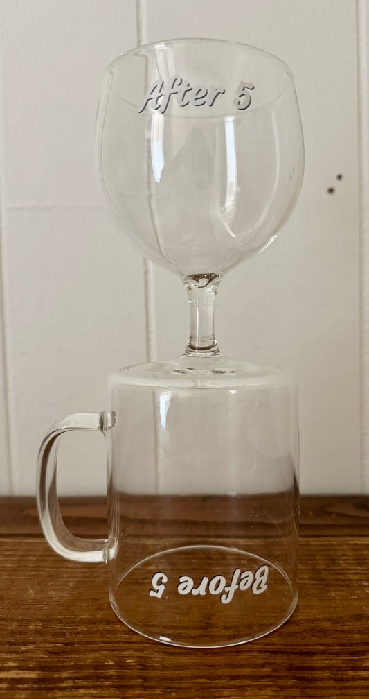 Clear glass mug with 'Before 5' and 'After 5' text on a wooden surface.