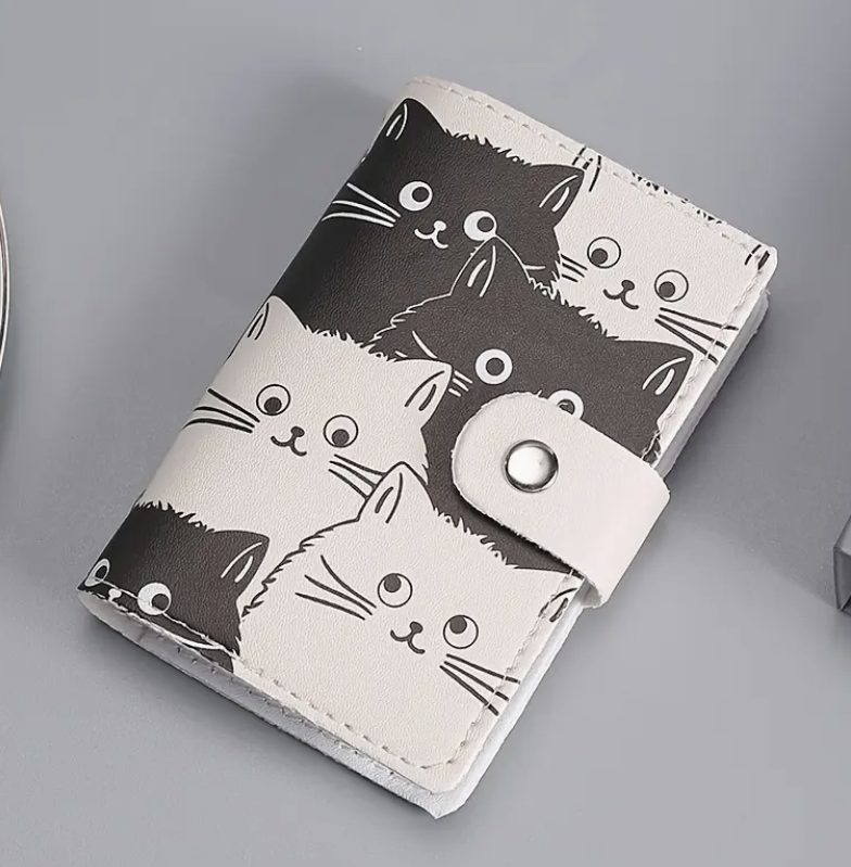 Cardholder with black and white cat illustrations on a gray background