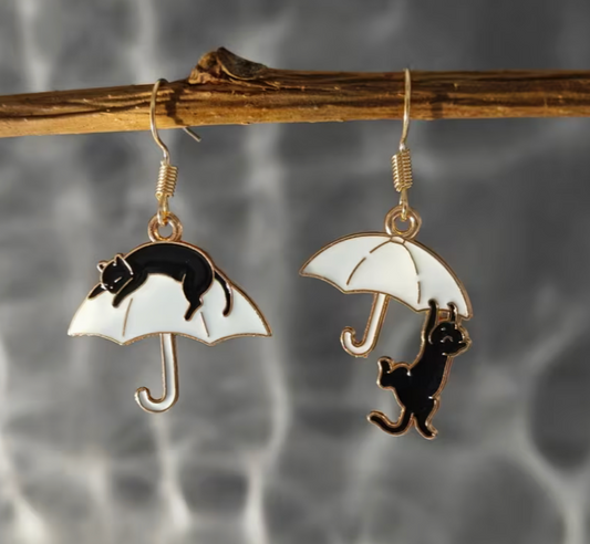 black cat umbrella dangle earrings with whimsical mismatched design and gold alloy hooks