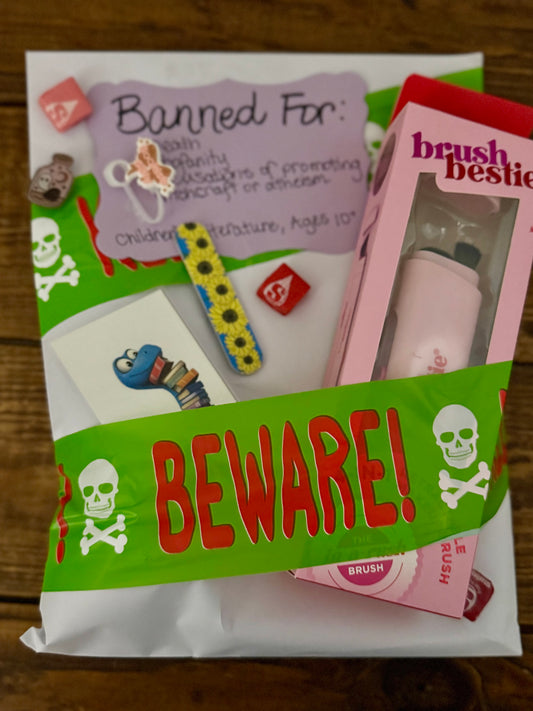 Product packaging with 'Beware!' warning and children's items inside