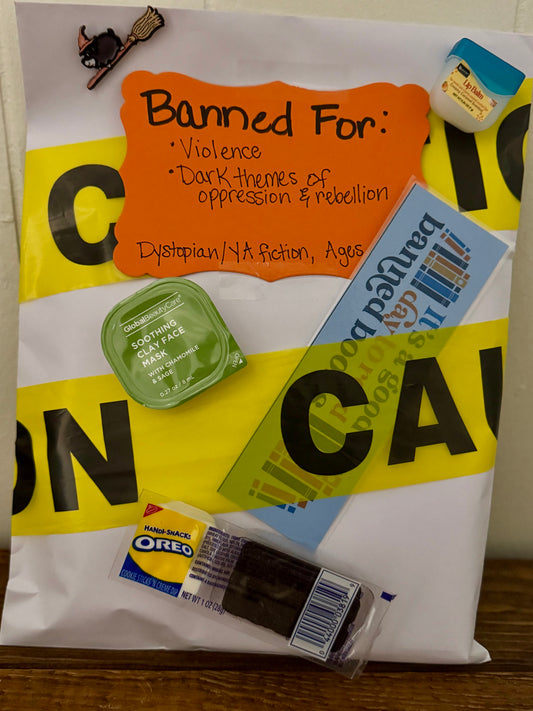 Product packaging with warning label and snacks on a white surface
