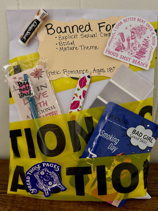 Collection of books and items with various labels and stickers on a yellow background