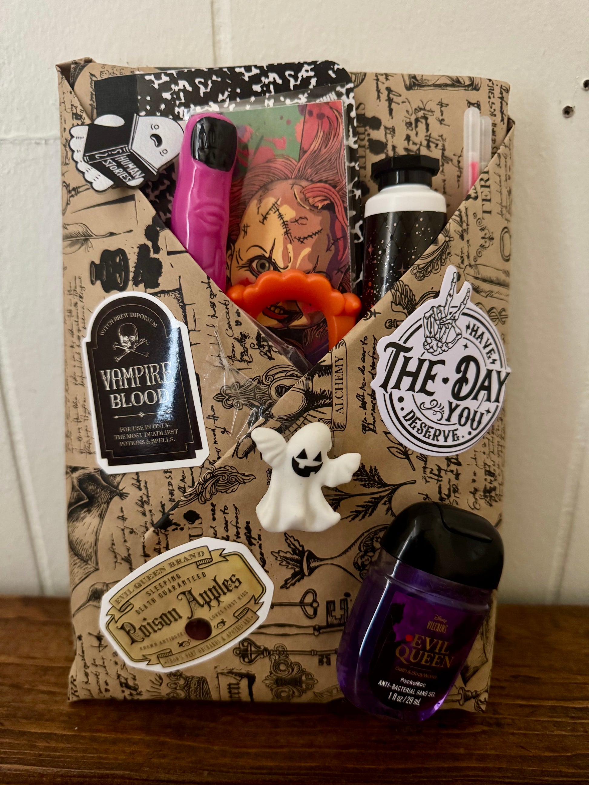 Halloween-themed gift bag with decorative elements on a wooden surface.