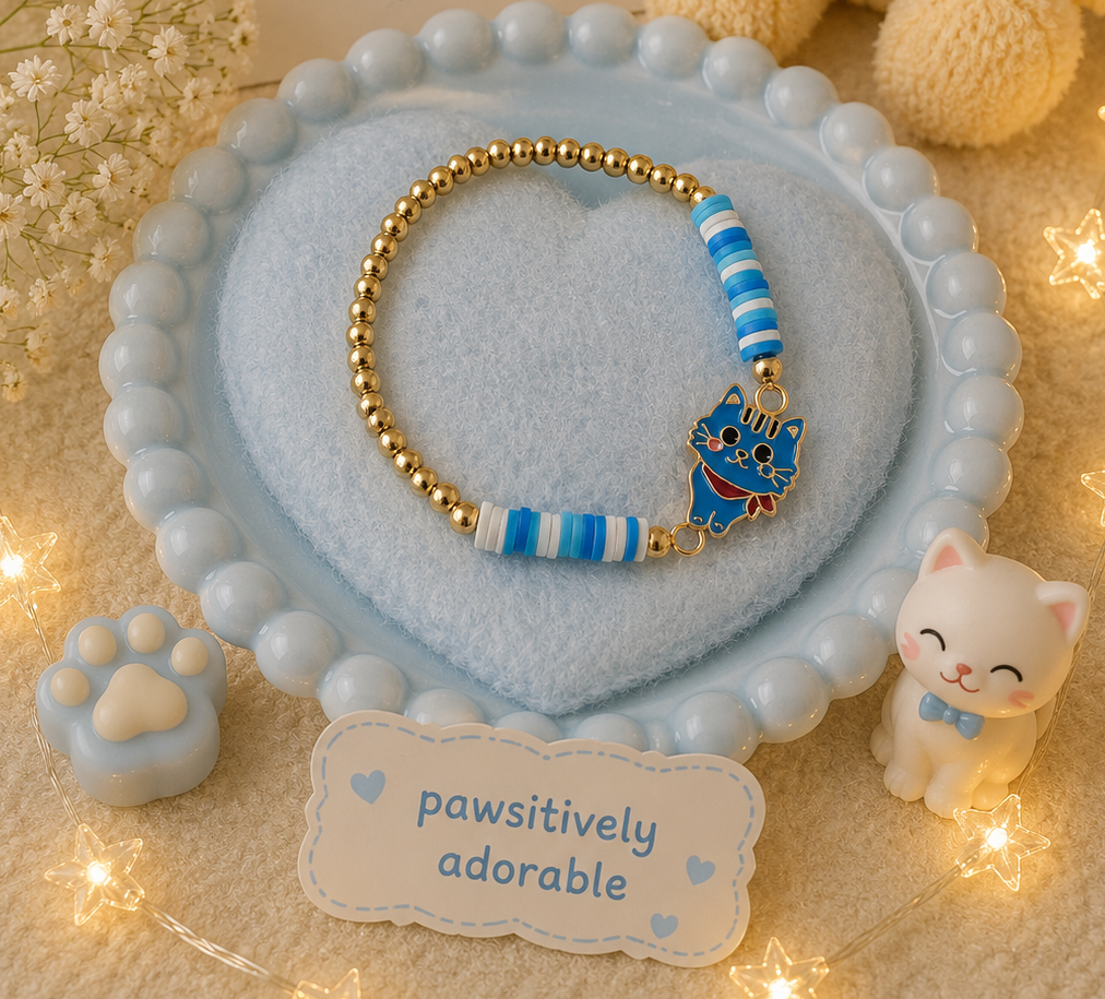 Blue cat charm bracelet with striped blue bead accents and gold-tone elastic beads