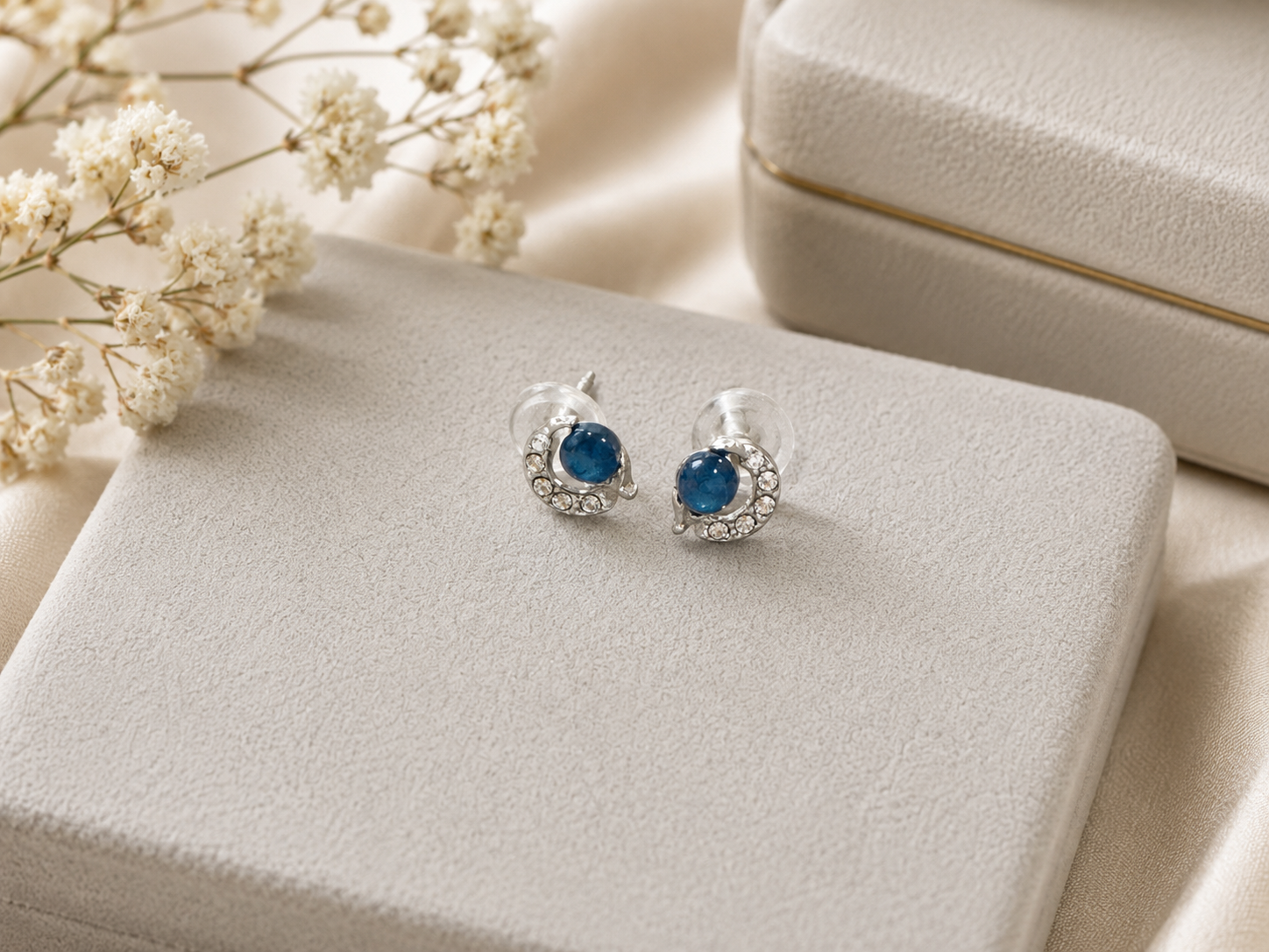 Blue cat eye moon and planet stud earrings with celestial silver detailing