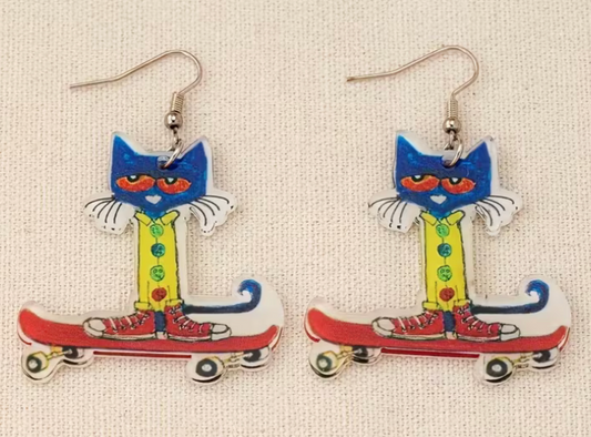 pair of colorful blue cat skateboard acrylic earrings with whimsical cartoon artwork and fishhook dangle backs