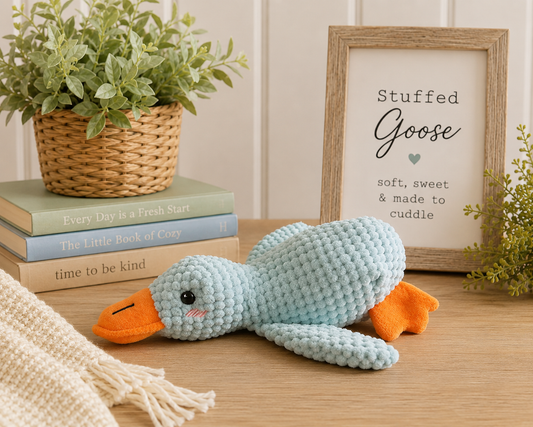 Soft blue goose plush stuffed animal with orange beak and feet, perfect for cuddling, nursery décor, and book lovers.