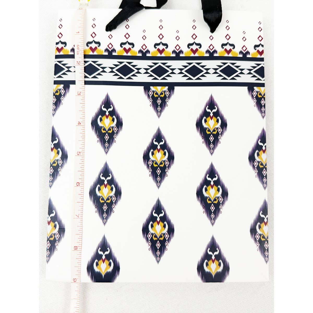 Assorted boho-style medium gift bags with geometric patterns and handles displayed together with size reference and individual designs