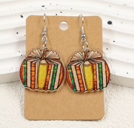 Colorful book pumpkin acrylic dangle earrings featuring vintage-style books arranged in a pumpkin shape