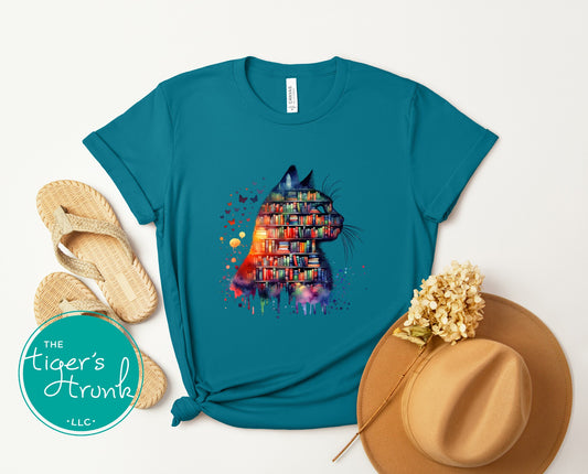 Teal unisex shirt with a watercolor cat silhouette filled with colorful books
